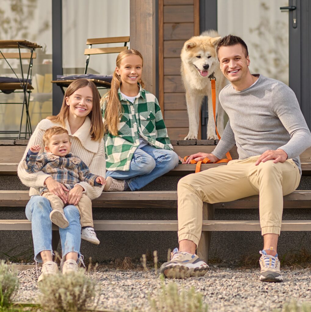 family sitting steps looking camera dog 1