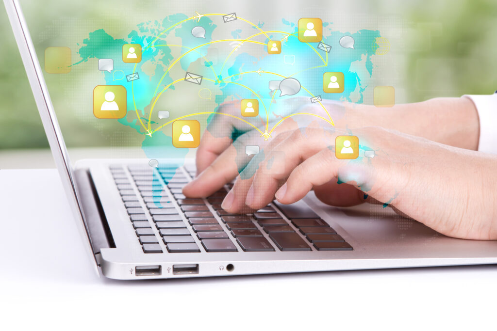 worker watching his laptop map world